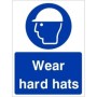 Wear Hard Hats mandatory safety sign with white helmet symbol on blue background