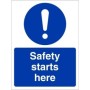 Safety Starts Here Sign with white safety symbol and text on blue background