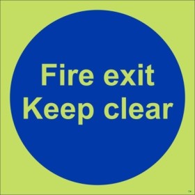 Glow in the dark Fire Exit Keep Clear door sign with photoluminescent background and blue mandatory symbol