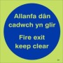 Glow in the dark Fire Exit Keep Clear door sign in Welsh and English
