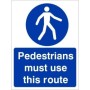 Pedestrians Must Use This Route Sign with white pedestrian symbol on blue background