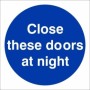 Close These Doors At Night mandatory sign with white text on a blue circular background