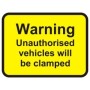Warning unauthorised vehicles will be clamped sign with bold black text on yellow background