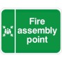 Fire assembly point traffic sign with white text and symbol on green background
