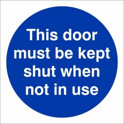 This Door Must Be Kept Shut When Not In Use mandatory door sign with white text on a blue circular background